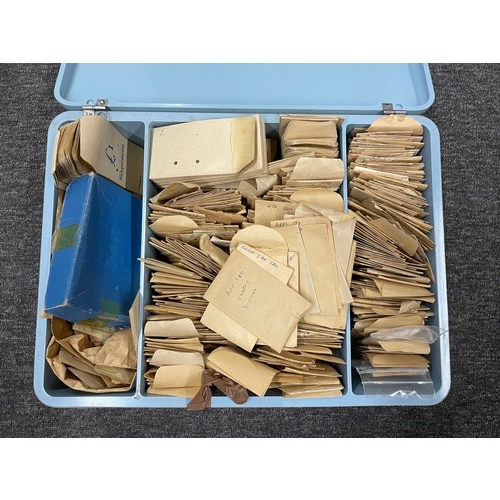 841 - Chest containing a quantity of wristwatch staffs and stems, within named envelopes, assorted brands... 