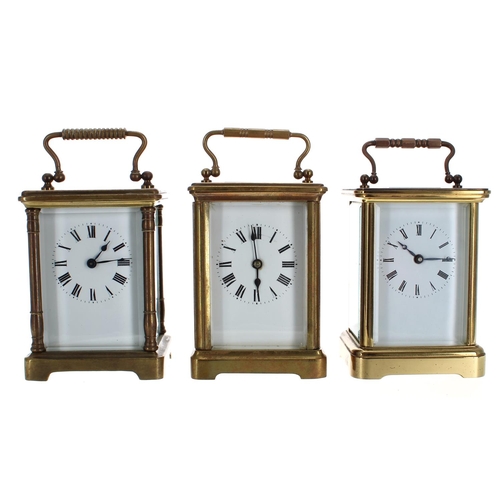 1212 - Three brass carriage clock timepieces, all in associated Morocco leather travelling cases (two keys)... 