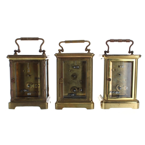 1212 - Three brass carriage clock timepieces, all in associated Morocco leather travelling cases (two keys)... 