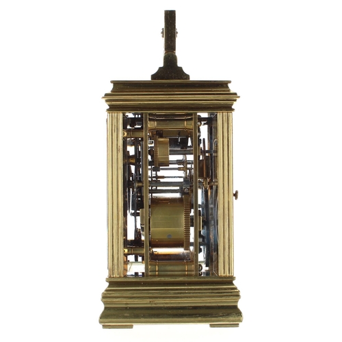 1214 - Repeater carriage clock with alarm and striking on a gong, within a pillared gorge style brass case,... 