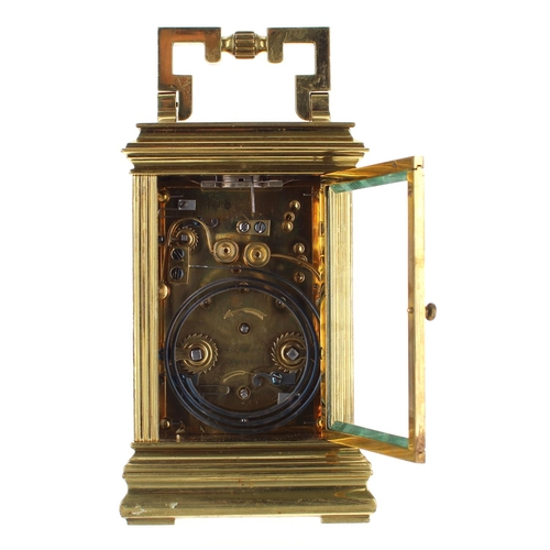 1214 - Repeater carriage clock with alarm and striking on a gong, within a pillared gorge style brass case,... 