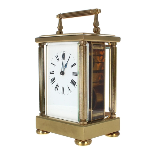 1219 - Large carriage clock timepiece within a fluted pillared brass case, 7