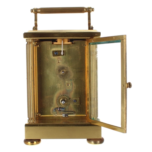 1219 - Large carriage clock timepiece within a fluted pillared brass case, 7