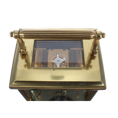 1219 - Large carriage clock timepiece within a fluted pillared brass case, 7