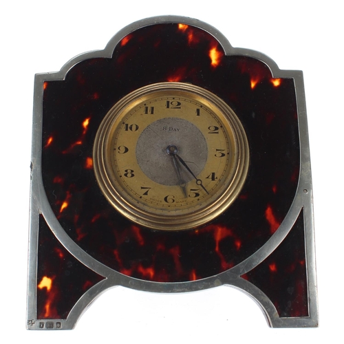 2504 - Small Swiss eight day tortoiseshell and silver mounted travelling easel clock timepiece, London 1924... 