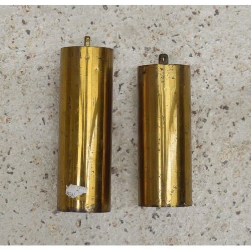 2004 - Two differing sized matched brass longcase clock weights (2)