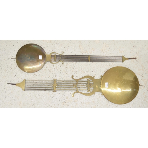 2014 - Two 19th century large brass Comtoise clock pendulums (2)