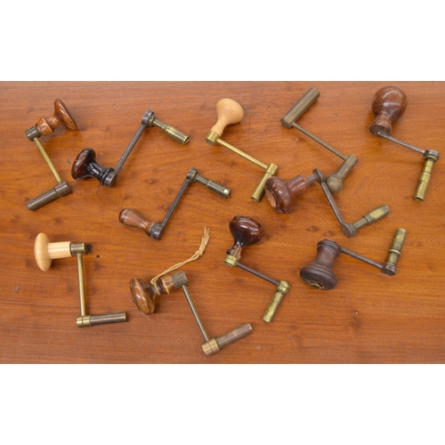 2107 - Eleven various crank handle clock winding keys, mostly with turned wooden handles (11)... 