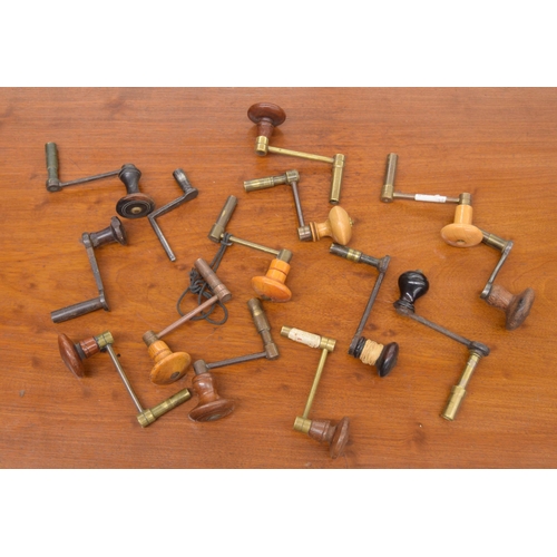 2112 - Fourteen various crank handle clock winding keys with turned wooden handles (14)... 