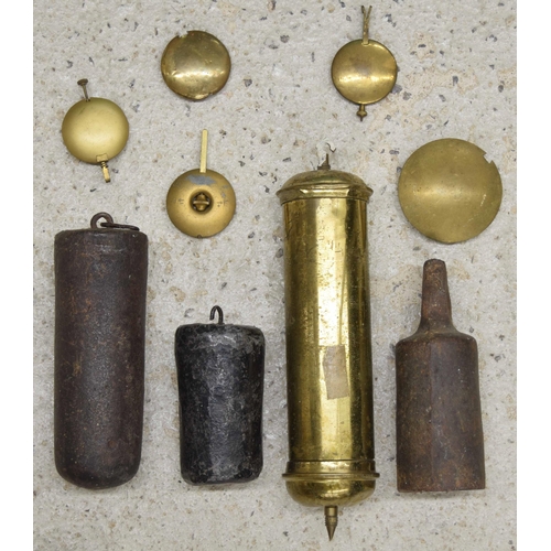 2118 - Four various large clock weights, three pendulums and two bobs (9)