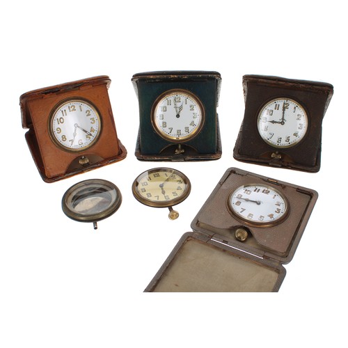 2507 - Three eight days travel clocks within travel cases; also two travel clocks, one within a travel case... 