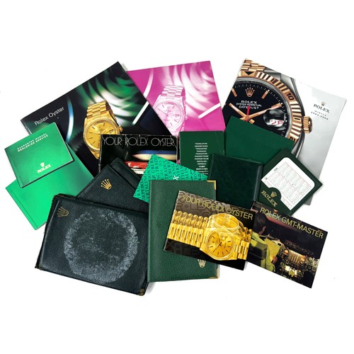 800C - Rolex - selection of green sleeves and calendar holders, two Rolex brochures, booklets etc... 