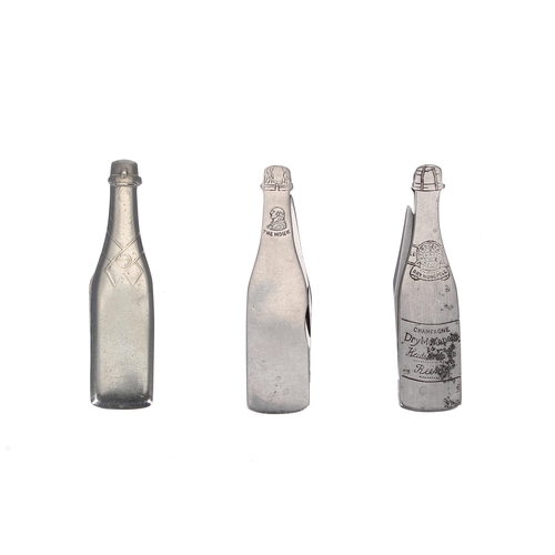 654 - Three novelty Champagne penknives, modelled as branded bottles including Moet & Chandon (3)... 