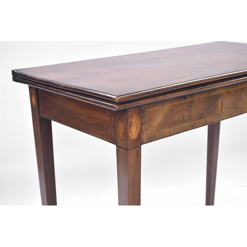 937 - 19th century mahogany fold-over tea table, the moulded hinged top over a box wood banded with shell ... 