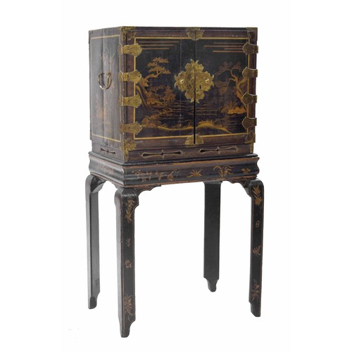 959 - 19th century Chinese lacquer and brass mounted cabinet on stand, the decorated cabinet with two door... 