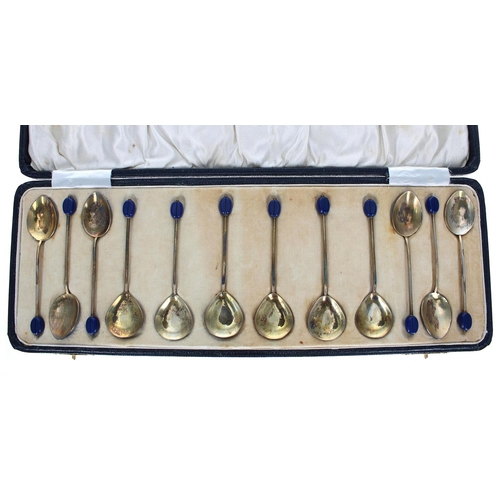 606 - Good set of twelve George V enamelled silver coffee spoons, comprising two sets of six bowl shape, e... 