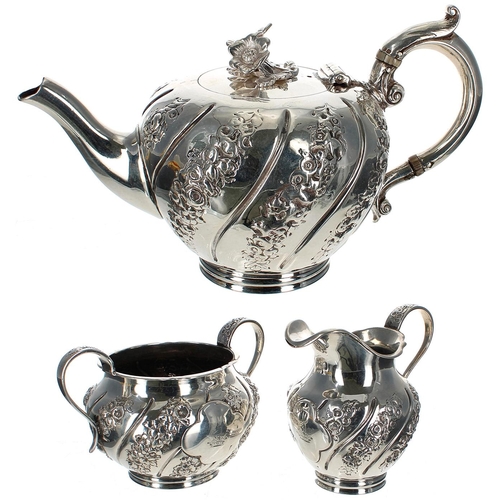 586 - Victorian silver bachelor three piece tea set, of melon form with wrythen foliate and floral embosse... 