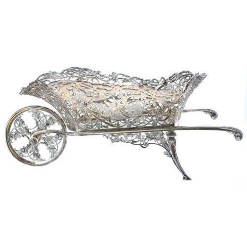 1186 - Impressive novelty large silver and plated sweetmeat wheelbarrow dish, the pierced foliate basket ca... 