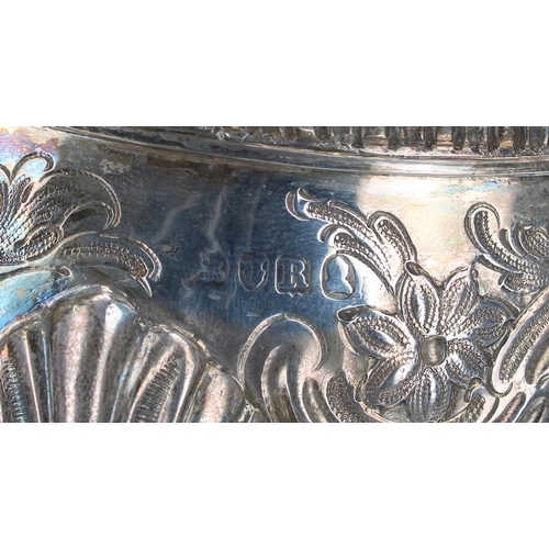 1194 - George III silver sauce boat, leaf cast leaf capped handle and repousse foliate body over three shel... 