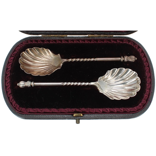 1211 - Cased pair of Victorian shell cast silver spoons, maker Josiah Williams & Co, London 1892, 5