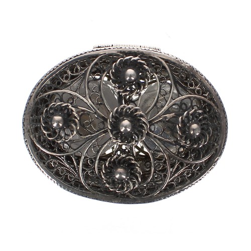 1182 - Attractive filigree white metal oval scent bottle holder, the foliate hinged top enclosing a pair of... 