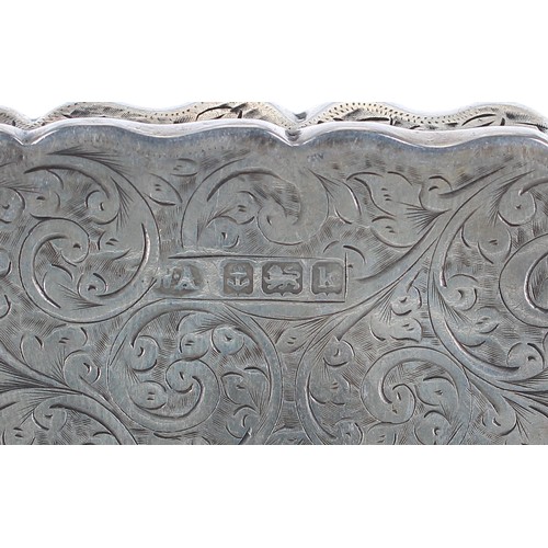 1213 - Edwardian silver engraved rectangular snuff box, decorated with foliate scrolls and a lobed rim, the... 