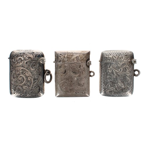 1215 - Three silver engraved silver vesta cases, 1.4 oz t in total (3)