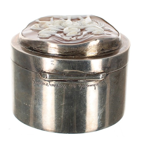 1216 - Edwardian silver oval trinket box, the hinged top  inset with a carved shell cameo depicting the thr... 