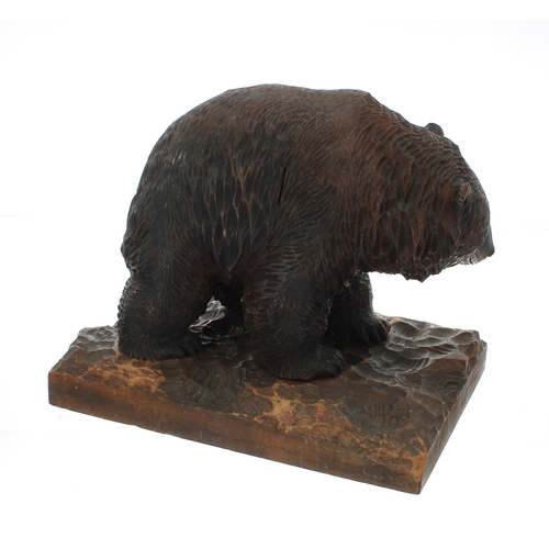 1303 - Good Japanese carved hardwood bear figure, upon a naturalistic carved plinth, 11.5