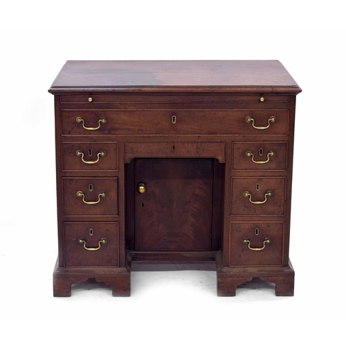 1426 - George III mahogany kneehole desk, the rectangular moulded top over a pull-out slide, single long dr... 