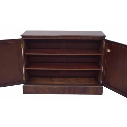 1428 - Victorian mahogany low library cupboard, the rectangular moulded top over double panelled doors encl... 