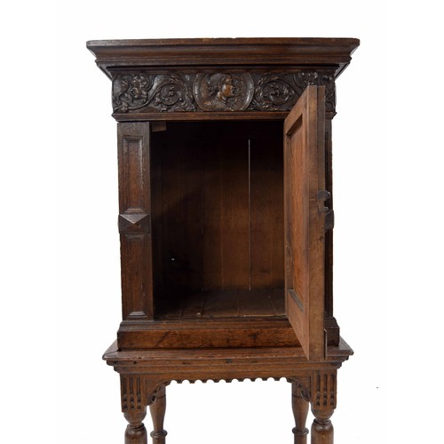 933 - 19th century oak cupboard on stand in the Elizabethan style, with a foliate carved frieze over an ar... 