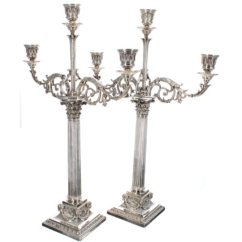 Good pair of Elkington & Co. silver plated Corinthian column candelabra, constructing in multiple formulae consisting of two single candlesticks; two three sconce candelabra or; a single and a five sconce candelabra, cast with leaf scroll branches, upon square bases with swag decoration, 20.5" high