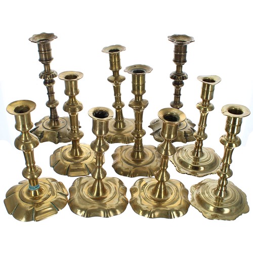 1249 - Five pairs of 18th century petal base brass candlesticks, tallest 8