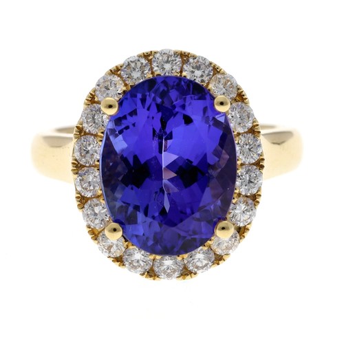 556 - Impressive 18ct yellow gold tanzanite and diamond set oval cluster ring, the tanzanite 6.57ct approx... 