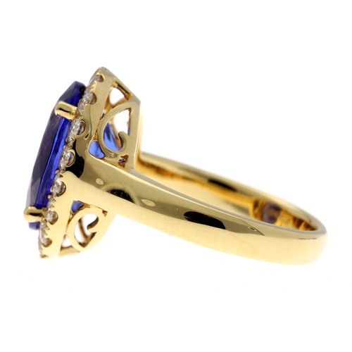 556 - Impressive 18ct yellow gold tanzanite and diamond set oval cluster ring, the tanzanite 6.57ct approx... 