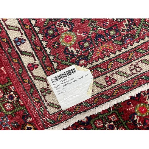 898 - Iranian Hossienabad carpet runner, labelled, 113