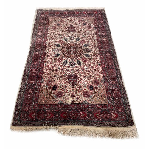 901 - Persian pattern rug, with central medallion on a dense foliate ground within multiple borders, 92