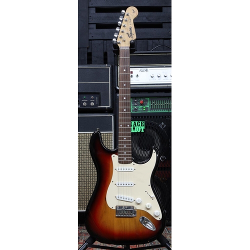 991 - Squier by Fender Strat electric guitar, made in China, sunburst finish (imperfections), with gig bag... 