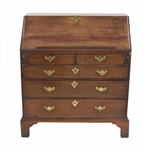 986 - Georgian mahogany bureau, the hinged fall-front enclosing a fitted interior with pigeon holes and sh... 