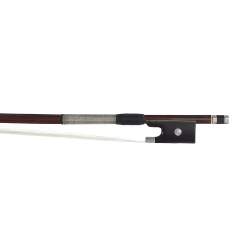 3228 - Silver mounted violin bow, unstamped, the stick octagonal, the ebony frog inlaid with pearl eyes and... 