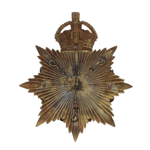 1148 - Royal Warwickshire Regiment helmet badge, the gilt metal eight point star plate with a crown around ... 