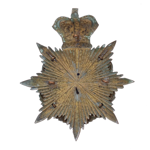 1151 - The Royal Sussex Regiment helmet badge, the metal eight point star plate with a crown around a laure... 