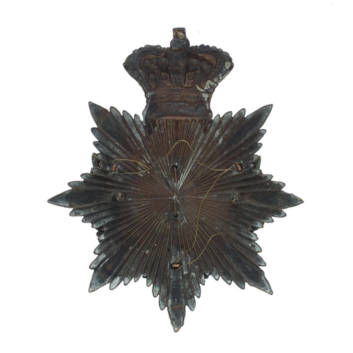 1152 - The Yorkshire Regiment helmet badge, the brass eight point star plate with a crown around a laurel g... 