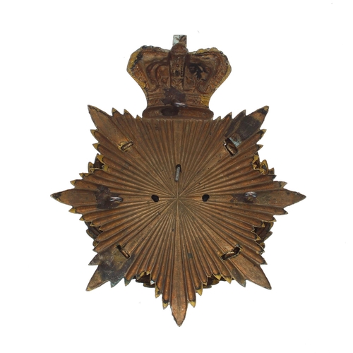 1155 - The Manchester Regiment helmet badge, the metal eight point star plate with a crown around a la... 