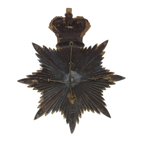 1156 - The Lothian Regiment helmet badge, the Brunswick Star plate around a laurel garland and strap m... 