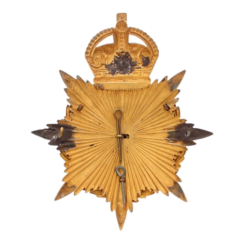 1162 - The East Surrey Regimental helmet badge, the Brunswick Star plate around a laurel garland and strap ... 