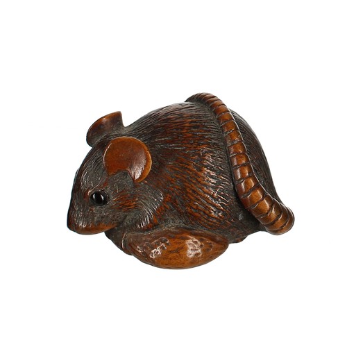 1306 - Japanese carved wood netsuke modelled as a rat with a fruit, himotoshi to the underside between the ... 