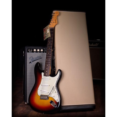 1963 Fender Stratocaster electric guitar, made in USA; Body: three-tone sunburst finish, a few very light surface marks, generally in exceptional condition for age; Neck: maple; Fretboard: rosewood; Frets: good, original; Electrics: working; Hardware: good; Case: original white tolex hard case with outer protective padded cover; Weight: 3.47kg; Overall condition: excellent