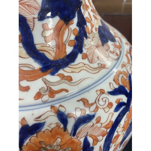 739 - Japanese Imari pattern baluster vase, decorated in a typical palette with birds in a garden panels o... 